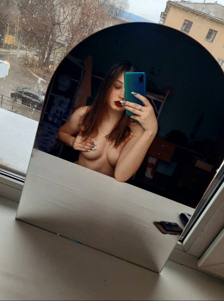 Sexy curvy teen lip bite on ottoman, taut rear solo bare sensual shot